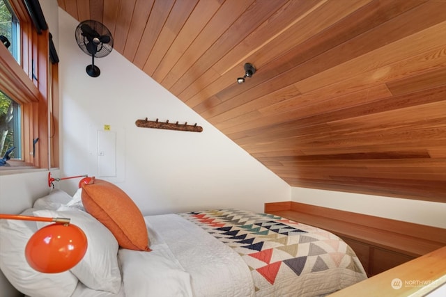 bedroom featuring wooden ceiling and lofted ceiling