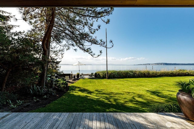 view of yard featuring a deck with water view