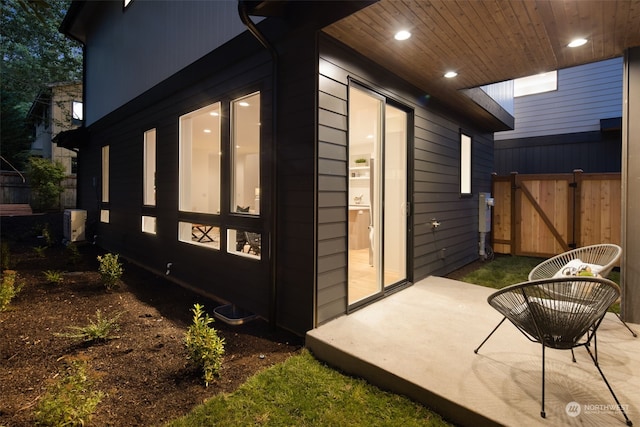 view of side of home featuring a patio area