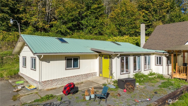 back of property featuring a patio