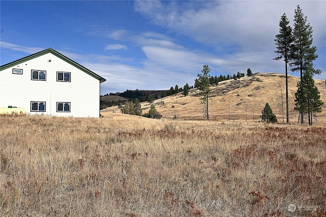 view of home's exterior with a mountain view