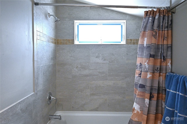 bathroom with shower / bathtub combination with curtain