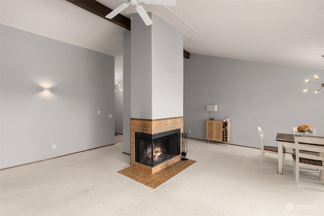 carpeted living room featuring a multi sided fireplace, ceiling fan, and vaulted ceiling