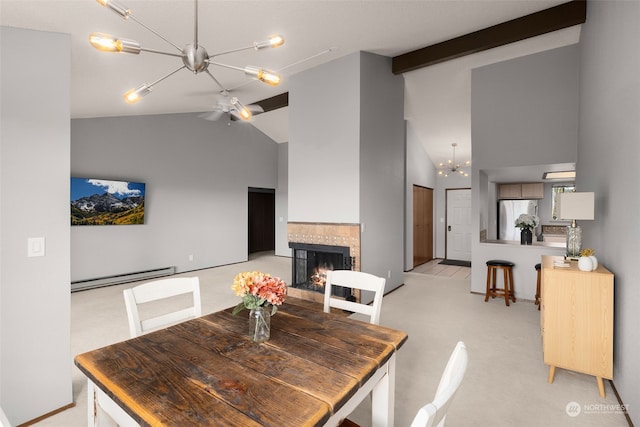 carpeted dining area featuring a baseboard heating unit, a tiled fireplace, ceiling fan, beam ceiling, and high vaulted ceiling