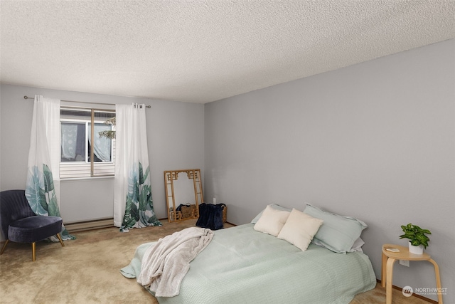 bedroom with light carpet, a textured ceiling, and a baseboard radiator