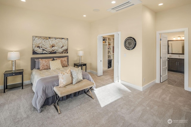 bedroom with baseboards, a spacious closet, recessed lighting, carpet floors, and visible vents