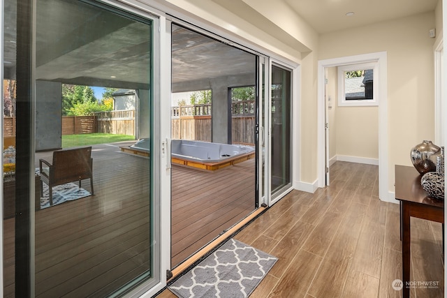 doorway to outside featuring hardwood / wood-style flooring