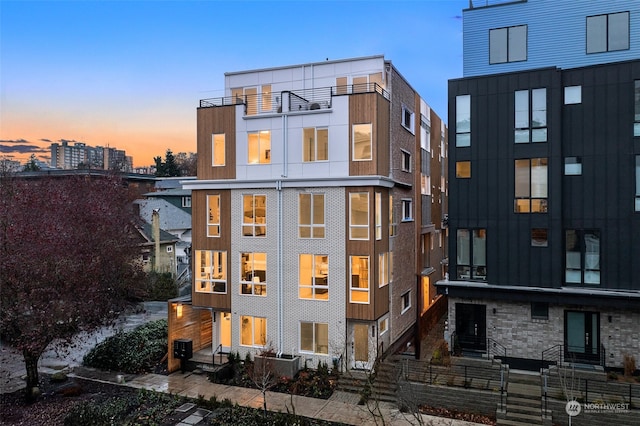 view of back house at dusk