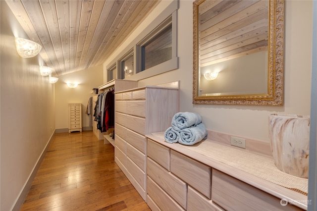 hall with wood ceiling and hardwood / wood-style flooring