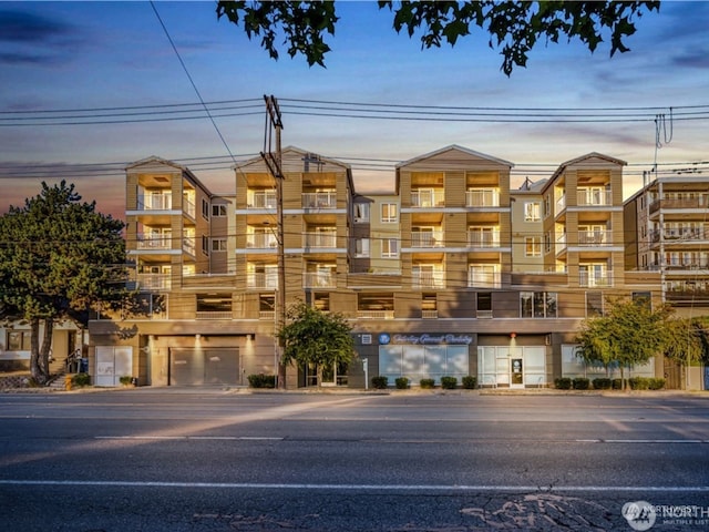 view of outdoor building at dusk