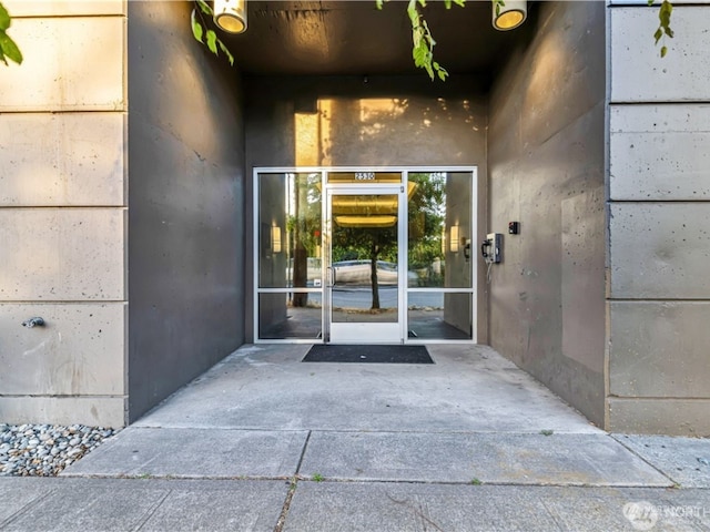 entrance to property featuring a patio