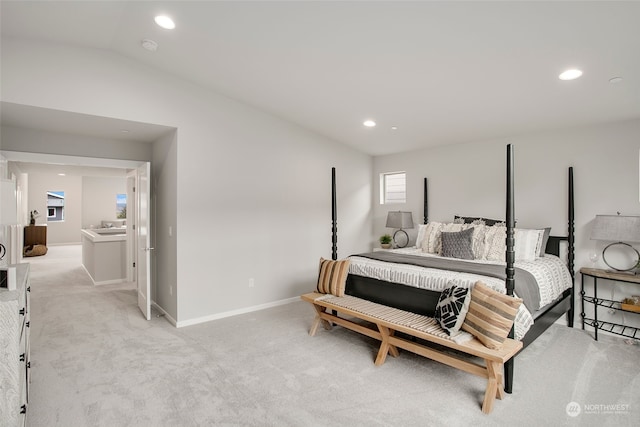 carpeted bedroom with lofted ceiling