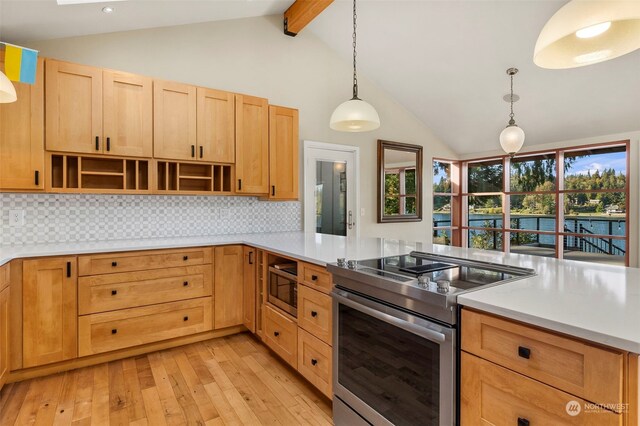 kitchen featuring light hardwood / wood-style floors, tasteful backsplash, kitchen peninsula, hanging light fixtures, and appliances with stainless steel finishes