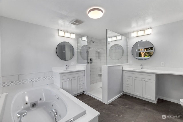 bathroom with independent shower and bath and vanity