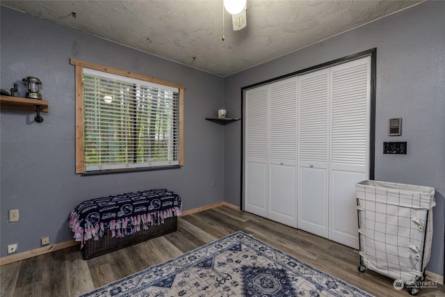 interior space with ceiling fan and dark wood-type flooring