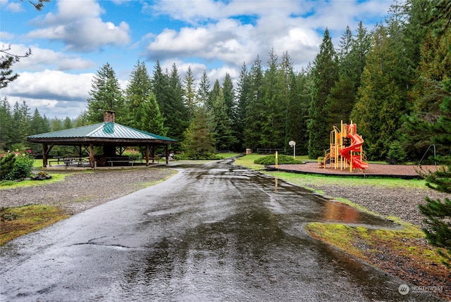 view of property's community with a playground and a gazebo