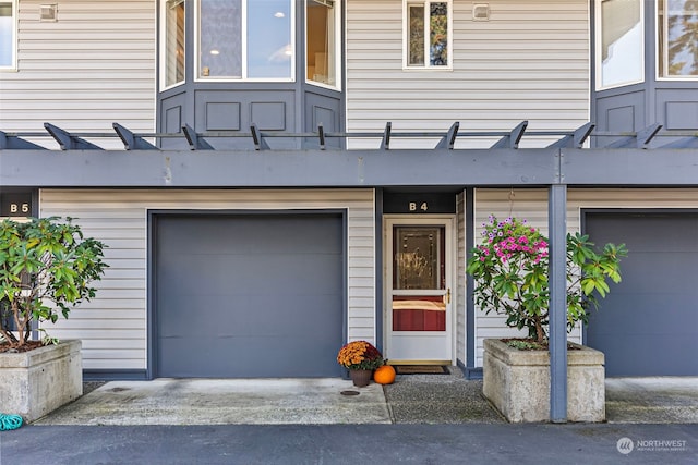 view of exterior entry featuring a garage