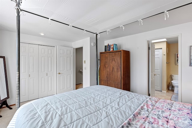 bedroom with a closet and connected bathroom