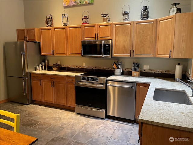 kitchen featuring appliances with stainless steel finishes and sink