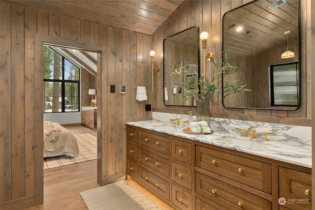 bathroom with wood walls, wood-type flooring, wooden ceiling, and vaulted ceiling