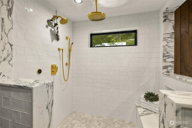 bathroom with tiled shower