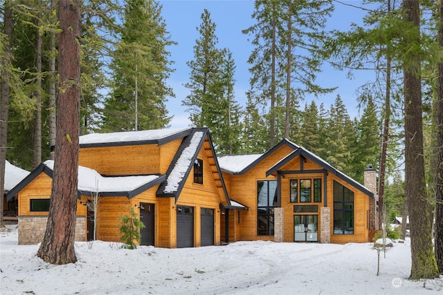 log cabin featuring a garage