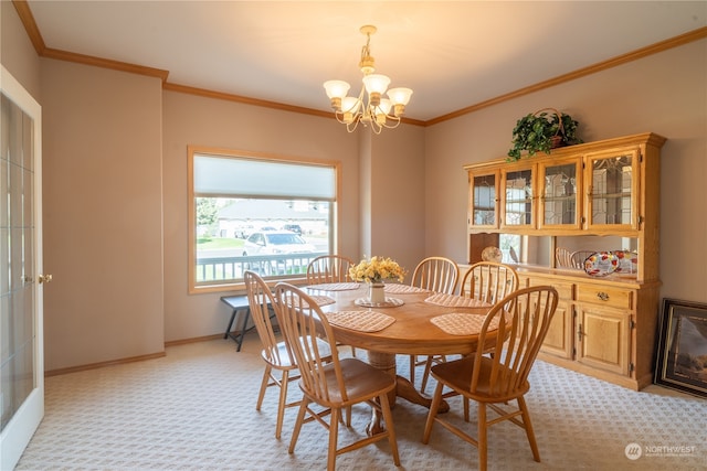 carpeted dining space with a notable chandelier and ornamental molding