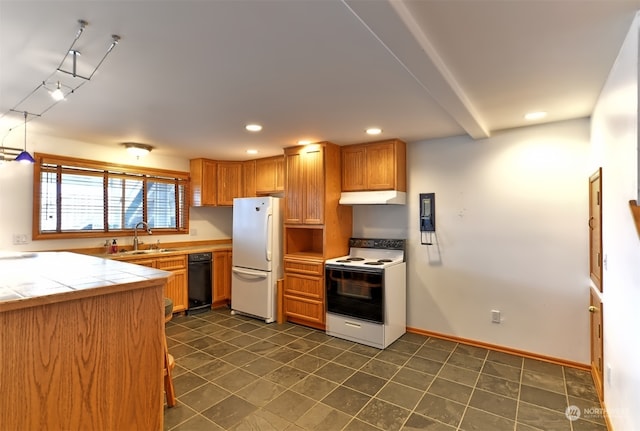 kitchen featuring white appliances and sink