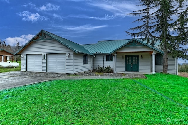 single story home with a garage and a front yard