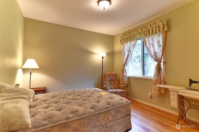 bedroom with wood-type flooring