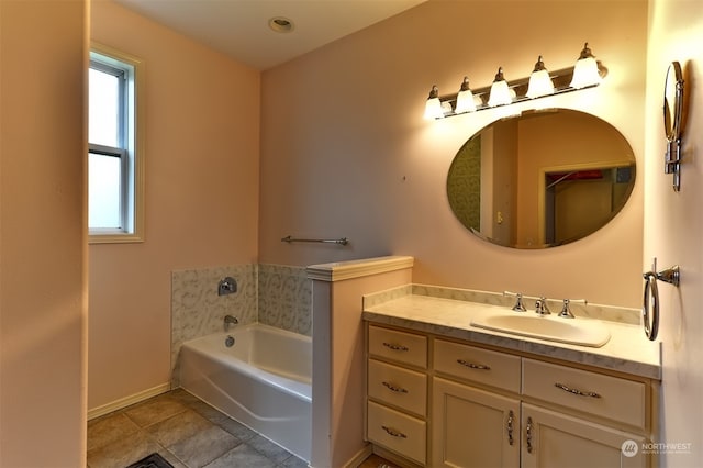 bathroom with vanity, a bathing tub, and tile patterned flooring