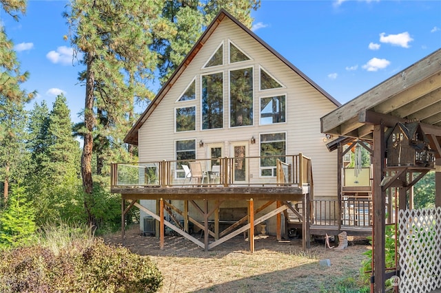 back of property featuring central AC and a deck