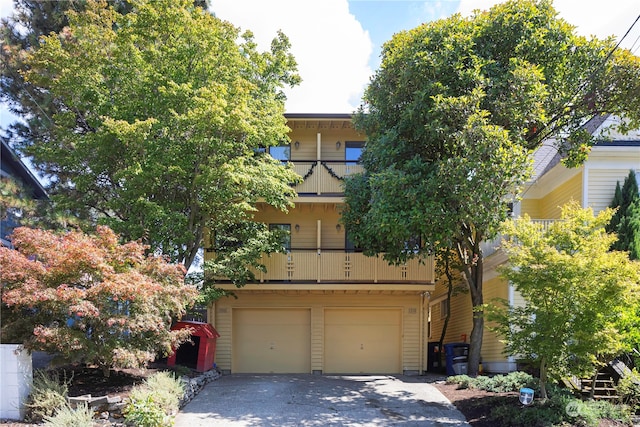 view of front facade with a balcony and a garage