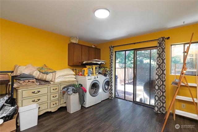 washroom with cabinets, dark wood-type flooring, and washing machine and clothes dryer