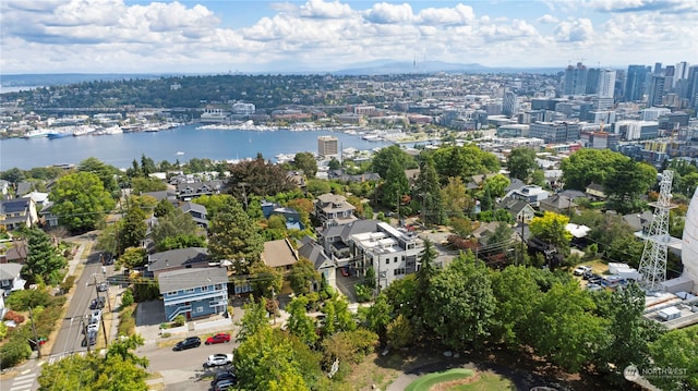 birds eye view of property with a water view