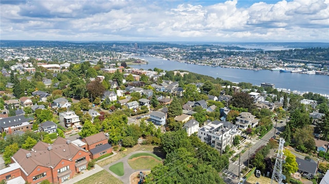 birds eye view of property with a water view