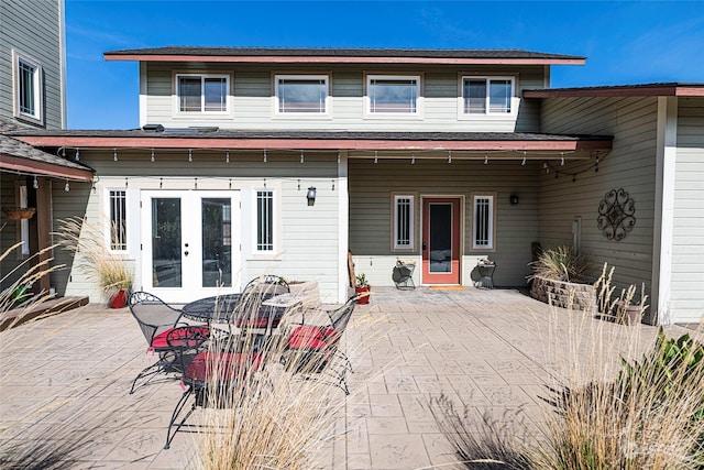 rear view of property with a patio area and french doors