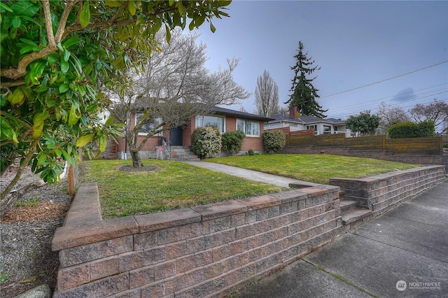 4109 N Huson St, Tacoma, WA 98407 - view of front facade with a front lawn, brick siding, and fence