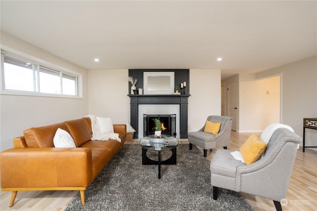 4109 N Huson St, Tacoma, WA 98407 - living room featuring light wood-style floors, a warm lit fireplace, and recessed lighting