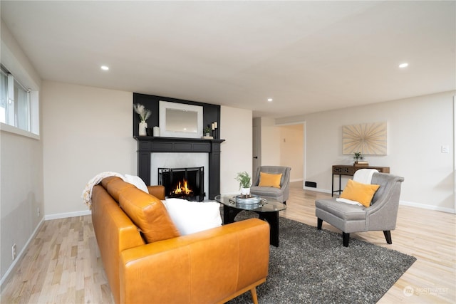 4109 N Huson St, Tacoma, WA 98407 - living room with light wood finished floors, a lit fireplace, and recessed lighting