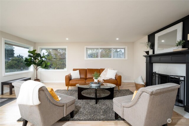 4109 N Huson St, Tacoma, WA 98407 - living room with light wood finished floors, recessed lighting, baseboards, and a high end fireplace