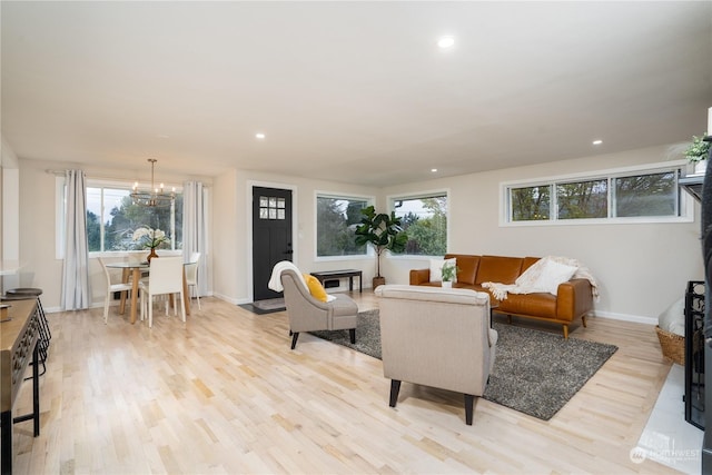 4109 N Huson St, Tacoma, WA 98407 - living area featuring baseboards, a notable chandelier, light wood finished floors, and recessed lighting