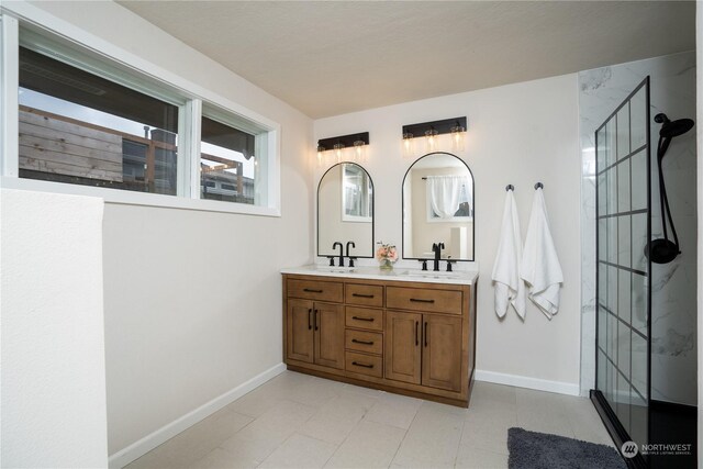 4109 N Huson St, Tacoma, WA 98407 - full bathroom with double vanity, baseboards, a stall shower, and a sink