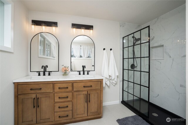 4109 N Huson St, Tacoma, WA 98407 - full bath with a marble finish shower, baseboards, double vanity, and a sink