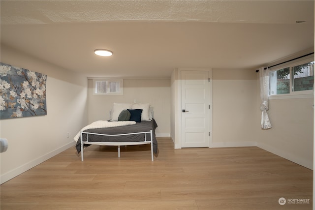 bedroom featuring light wood-type flooring