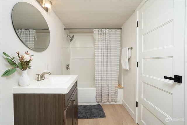 4109 N Huson St, Tacoma, WA 98407 - bathroom with shower / tub combo with curtain, wood finished floors, and vanity