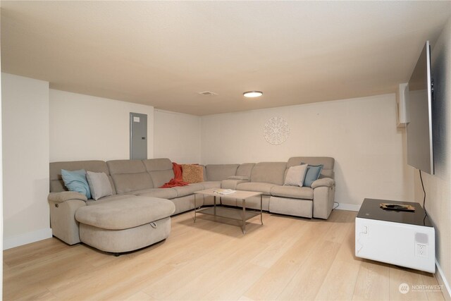4109 N Huson St, Tacoma, WA 98407 - living area featuring electric panel, light wood-style flooring, and baseboards