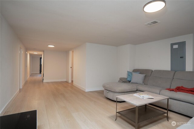 4109 N Huson St, Tacoma, WA 98407 - living room with electric panel, light wood finished floors, baseboards, and visible vents