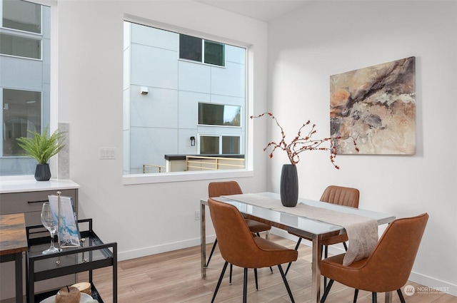 dining room with light wood-type flooring