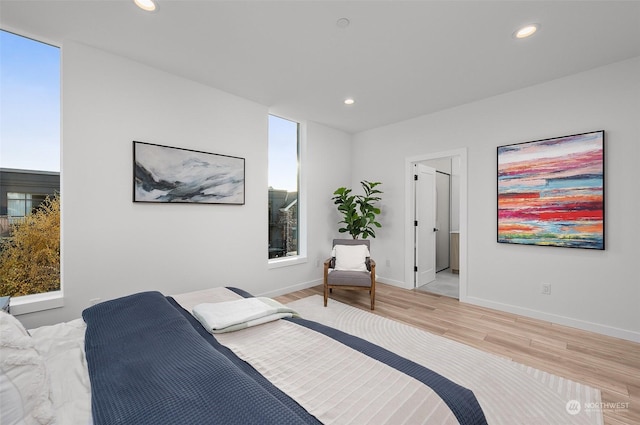 bedroom with hardwood / wood-style flooring